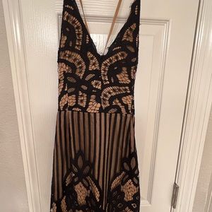 Tobi brand mini dress excellent condition ties up in back so cute lace detail